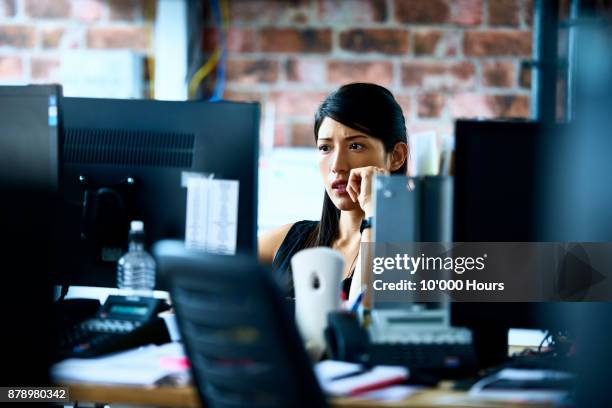 woman working in modern office - indecision ストックフォトと画像