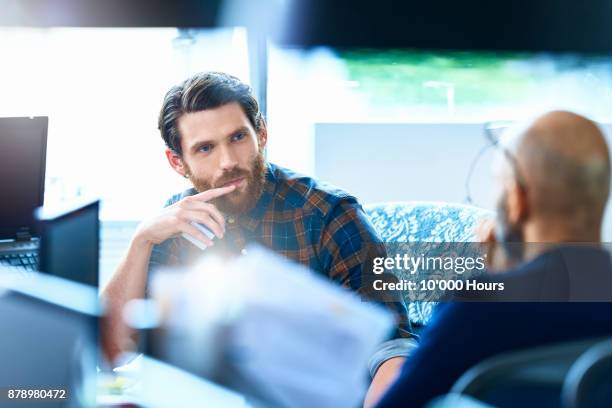 men working in modern office - handsome native american men stock pictures, royalty-free photos & images