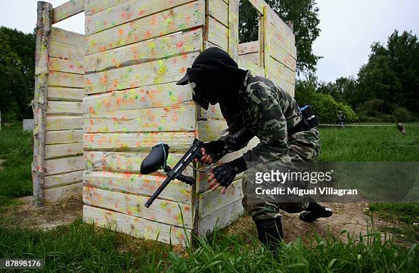 Man shoots with a paintball marker at the Gotcha playground on May 21, 2009 in Vysocany, Czech Republic. The German government has abandoned its plan...
