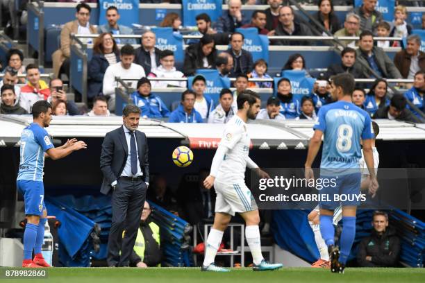 Malaga's coach Michel looks at his players during the Spanish league football match Real Madrid CF against Malaga CF on 25, November 2017 at the...