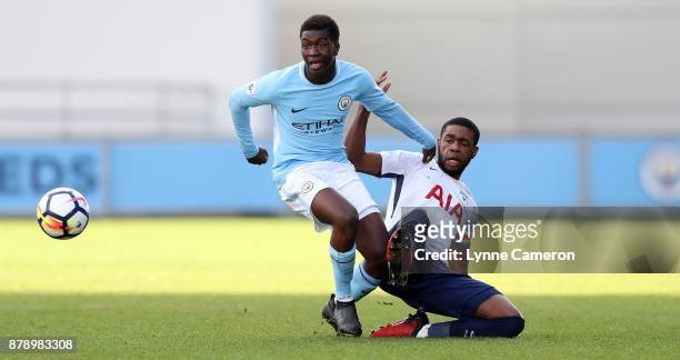 Japheth Tanganga of Tottenham Hotspur and Taylor Richards of Manchester City during the Premier League 2 match at The Academy Stadium on November 25,...