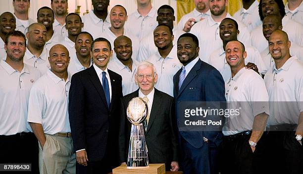 President Barack Obama poses with Pittsburgh Steelers Chairman Dan Rooney and Head Coach Mike Tomlin during a picture with the 2009 NFL Super Bowl...