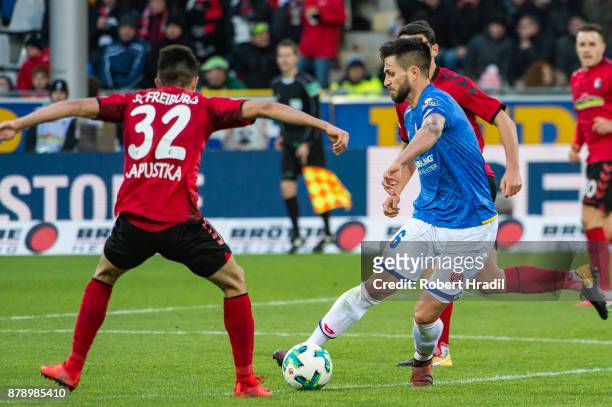 Danny Latza of Mainz vies with Bartosz Kapustka of Freiburg during the Bundesliga match between Sport-Club Freiburg and 1. FSV Mainz 05 at...