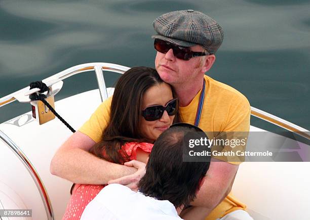 Chris Evans and wife Natasha Shishmanian depart the Red Bull hospitality centre by boat after practice for the Monaco Formula One Grand Prix at the...
