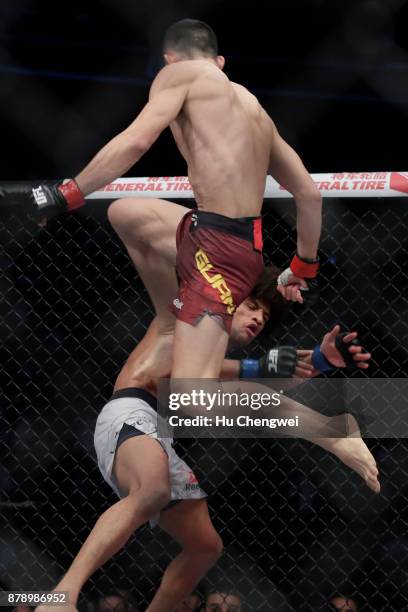 Wang Guan fights with Alex Caceres during the UFC Fight Night at Mercedes-Benz Arena on November 25, 2017 in Shanghai, China.