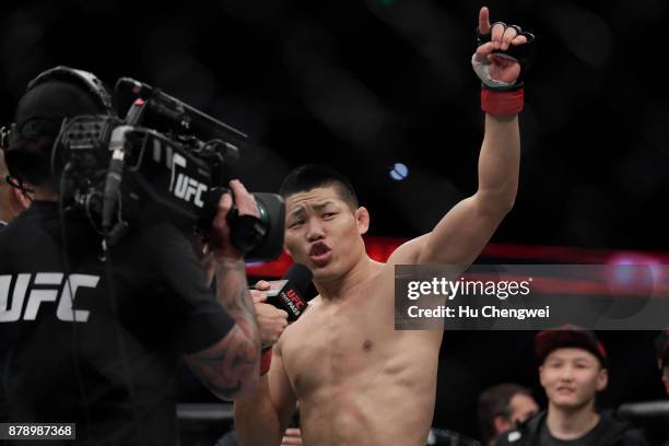 Li Jingliang reacts after his fight with Zak Ottow during the UFC Fight Night at Mercedes-Benz Arena on November 25, 2017 in Shanghai, China.