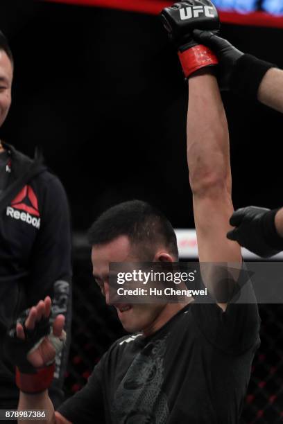 Wang Guan reacts after his fight with Alex Caceres during the UFC Fight Night at Mercedes-Benz Arena on November 25, 2017 in Shanghai, China.