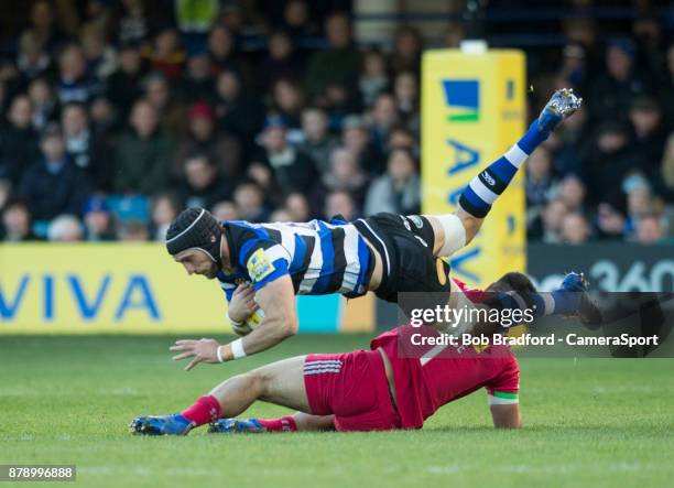 Bath Rugby's Luke Charteris is tackled by Harlequins' Lewis Boyce during the Aviva Premiership match between Bath Rugby and Harlequins at Recreation...