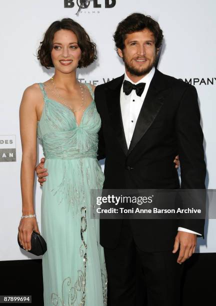 Actress Marion Cotillard and actor Guillaume Canet attends the amfAR Cinema Against AIDS 2009 benefit at the Hotel du Cap during the 62nd Annual...