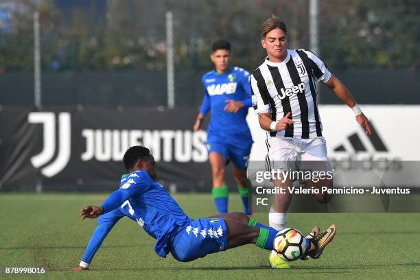Alessandro Tripaldelli of Juventus U19 is tackled by Dennis Joseph of US Sassuolo U19 during the Serie A Primavera match between Juventus U19 and US...