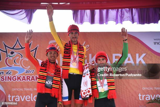 Red and White jersey winner Jamal Hibatullah of KFC Cycling Team Indonesia, yellow jersey winner Khalil Khorsid of Tabriz Shahrdary Team Iran, and...