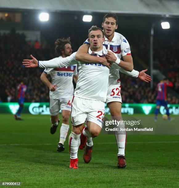 Xherdan Shaqiri of Stoke City celebrates scoring his sides first goal with Ramadan Sobhi of Stoke City during the Premier League match between...