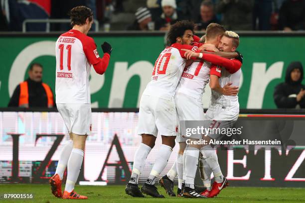 Caiuby of Augsburg, Alfred Finnbogason of Augsburg and Philipp Max of Augsburg) celebrate after Alfred Finnbogason of Augsburg scorned a goal to make...