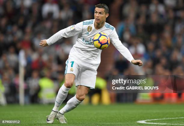 Real Madrid's Portuguese forward Cristiano Ronaldo controls the ball during the Spanish league football match Real Madrid CF against Malaga CF on 25,...