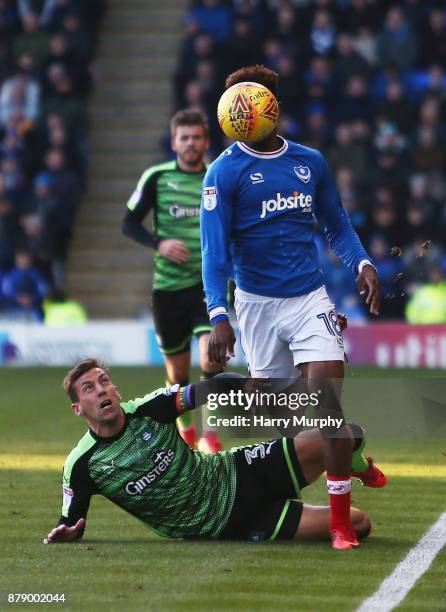 Jamal Lowe of Portsmouth and Gary Sawyer of Plymouth Argyle battle for possession during the Sky Bet League One match between Portsmouth and Plymouth...