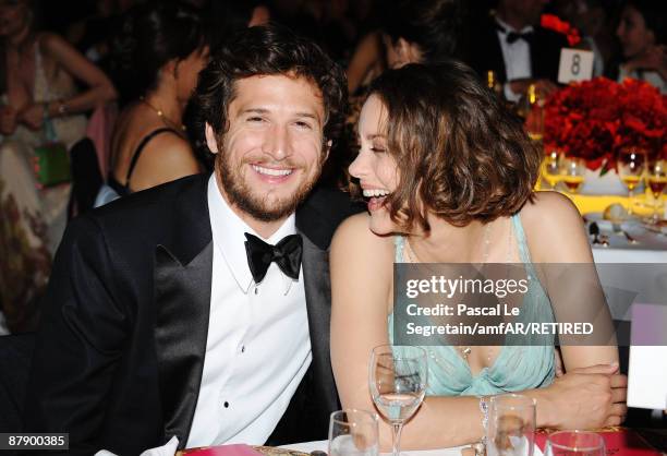 Marion Cotillard and Guillaume Canet attend the amfAR Cinema Against AIDS 2009 dinner at the Hotel du Cap during the 62nd Annual Cannes Film Festival...