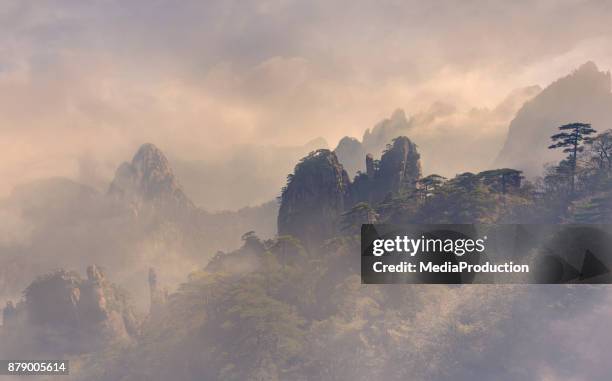 huangshan yellow mountains unesco world heritage center - huangshan mountains stock pictures, royalty-free photos & images