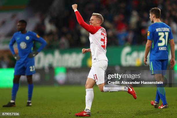 Philipp Max of Augsburg celebrates after Alfred Finnbogason of Augsburg scored a goal to make it 2:1 during the Bundesliga match between FC Augsburg...