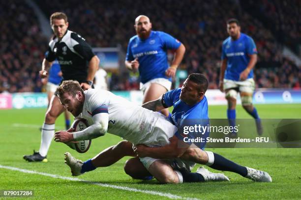 Elliot Daly of England touches down for the fourth try during the Old Mutual Wealth Series match between England and Samoa at Twickenham Stadium on...