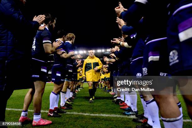 Stephen Moore of Australia walks through a guard of honor after the international match between Scotland and Australia at Murrayfield Stadium on...