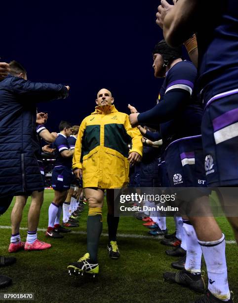 Stephen Moore of Australia walks through a guard of honor after the international match between Scotland and Australia at Murrayfield Stadium on...