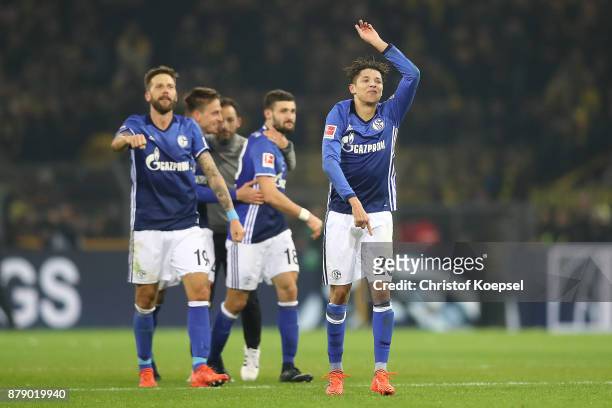 Amine Harit of Schalke and other players of Schalke celebrate after the Bundesliga match between Borussia Dortmund and FC Schalke 04 at Signal Iduna...