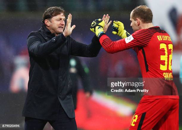 Ralph Hasenhuettl head coach of RB Leipzig celebrates the second goal with Peter Gulacsi of RB Leipzig during the Bundesliga match between RB Leipzig...