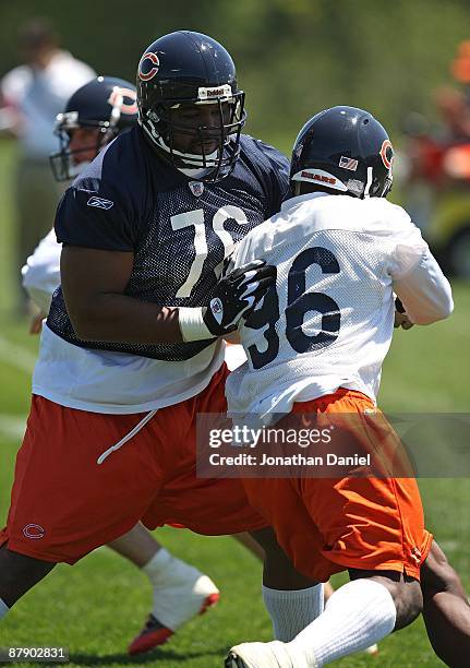 Orlando Pace of the Chicago Bears blocks Alex Brown during an organized team activity practice on May 20, 2009 at Halas Hall in Lake Forest, Illinois.