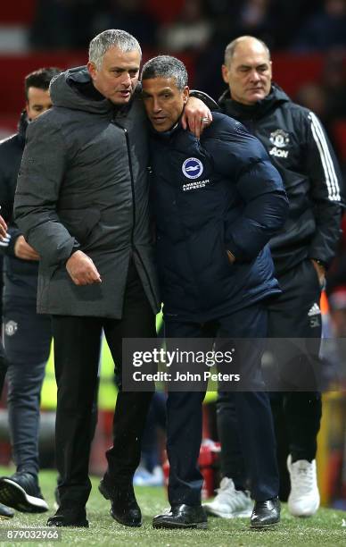 Manager Jose Mourinho of Manchester United embraces Manager Chris Hughton of Brighton and Hove Albion after the Premier League match between...