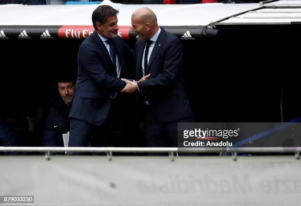 Real Madrid head coach Zinedine Zidane and Malaga head coach Michel Gonzalez before the La Liga match between Real Madrid and Malaga at Santiago...