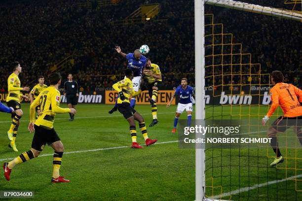 Schalke's Brazilian defender Naldo heads the ball to score despite of Dortmund's German goalkeeper Roman Weidenfeller during the German First...