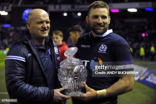 Scotland's flanker John Barclay and Scotland head coach Gregor Townsend pose with the Hopetoun Cup after the autumn international rugby union test...