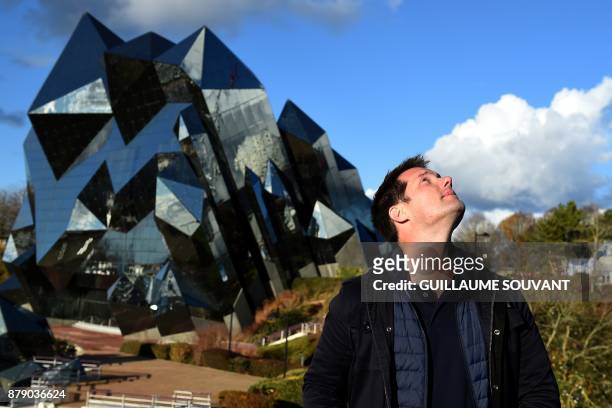 French astronaut Thomas Pesquet poses on November 25, 2017 in front of the Kinemax at the Futuroscope theme park in Chasseneuil-du-Poitou, Western...