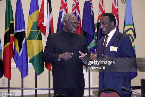 Surinam's President Ronald R.Venetiaan and Edwin W.Carrington, CARICOM Secretary General, talk during a break of the Eighth Meeting of the Council of...