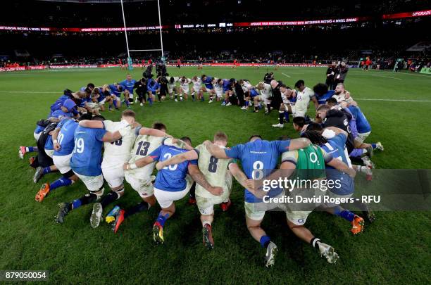 The England and Samoa team huddle together after the Old Mutual Wealth Series match between England and Samoa at Twickenham Stadium on November 25,...