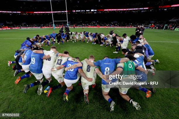 The England and Samoa team huddle together after the Old Mutual Wealth Series match between England and Samoa at Twickenham Stadium on November 25,...