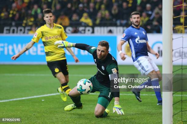 Goalkeeper Ralf Faehrmann of Schalke can't save the ball coming from Benjamin Stambouli of Schalke who scores an own goal to make it 2:0 during the...