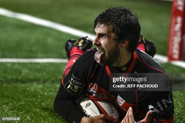 Oyonnax' French fullback Quentin Etienne reacts as he scores a try during the French Top 14 rugby union match between Oyonnax and Clermont-Ferrand on...