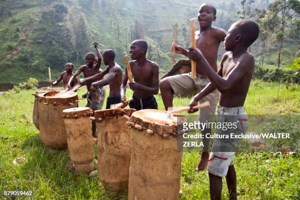 men drumming on burundi drum, masango, cibitoke, burundi, africa - burundi stock pictures, royalty-free photos & images