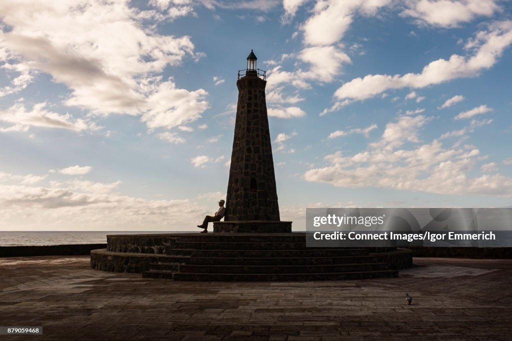 Man sitting, looking at sea view, Santa Cruz de Tenerife, Canary Islands, Spain, Europe