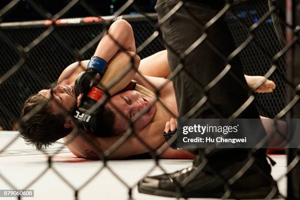 Cyril Asker fights with Hu Yaozong during the UFC Fight Night at Mercedes-Benz Arena on November 25, 2017 in Shanghai, China.