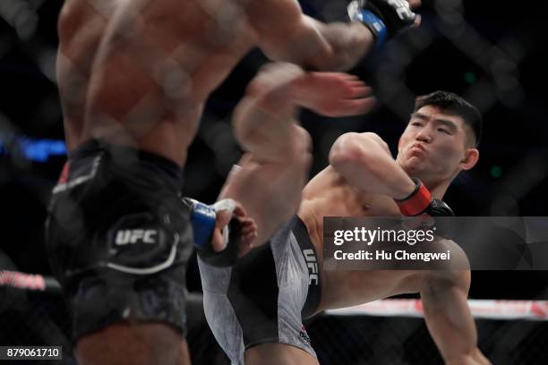 Song Yadong of China, right, kicks Bharat Khandare, left, during the UFC Fight Night at Mercedes-Benz Arena on November 25, 2017 in Shanghai, China.