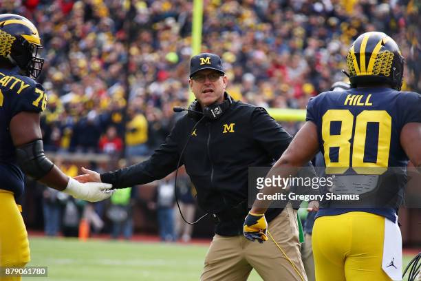 Jim Harbaugh head coach of the Michigan Wolverines celebrates a touchdown in the first half against the Ohio State Buckeyes on November 25, 2017 at...