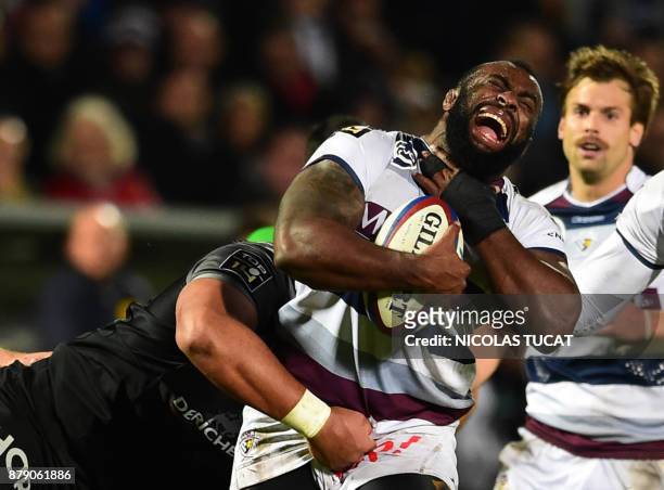 Bordeaux-Begles' Fijian prop Peni Ravai Kovekalou reacts as he is tackled during the French Top 14 rugby union match between Bordeaux-Begles and...