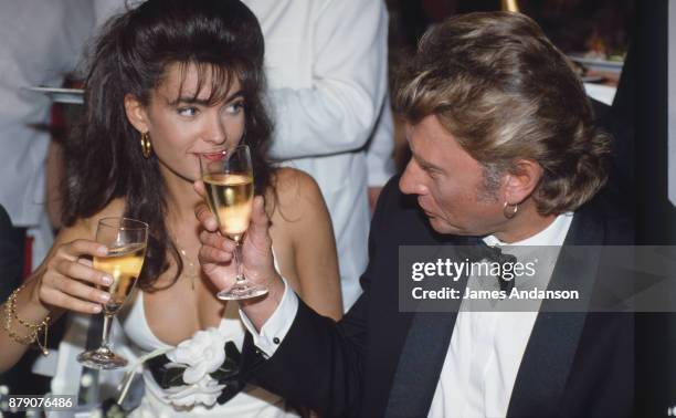 French singer Johnny Hallyday with his wife Adeline at opening dinner of 47th Cannes film festival, 10th May 1990