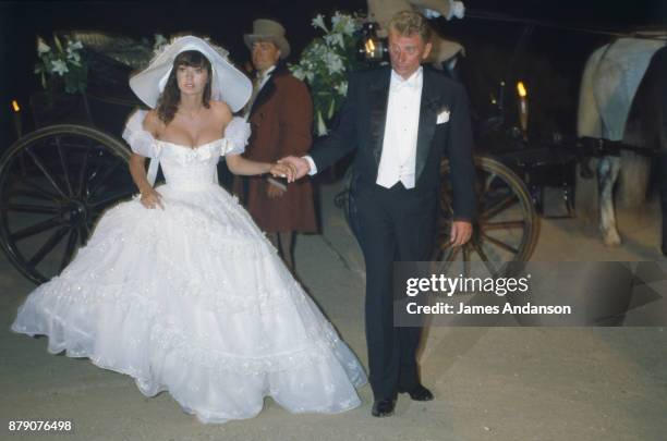 Newly wed Johnny Hallyday and Adeline Blondieau arriving at their wedding reception, Saint Tropez 09th July 1990