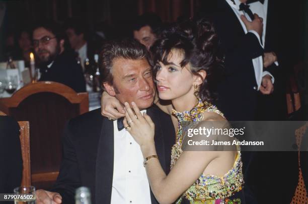 Paris, French singer Johnny Hallyday and his wife Adeline at 6th ceremony of "Victoires de la musique", 03nd February 1991