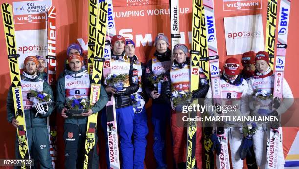 Norway's Team, who arrived first, Robert Johansson, Anders Fannemel, Daniel Andre Tande and Johann Andre Forfang, German tam, second placed, Markus...
