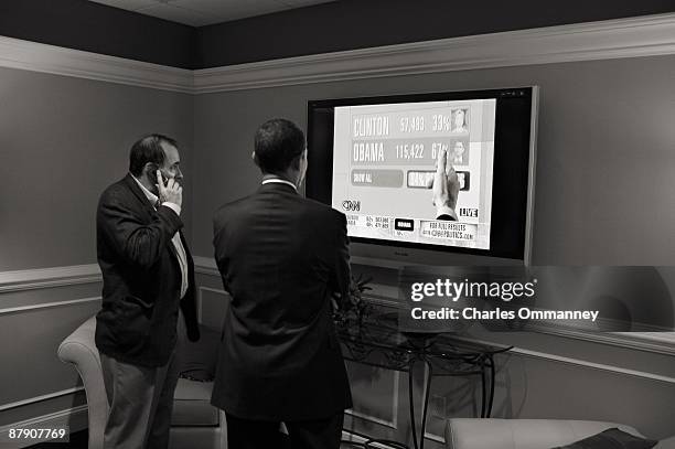 Democratic presidential hopeful Sen. Barack Obama and advisor David Axlerod backstage after speaking during a rally at the North Carolina State...