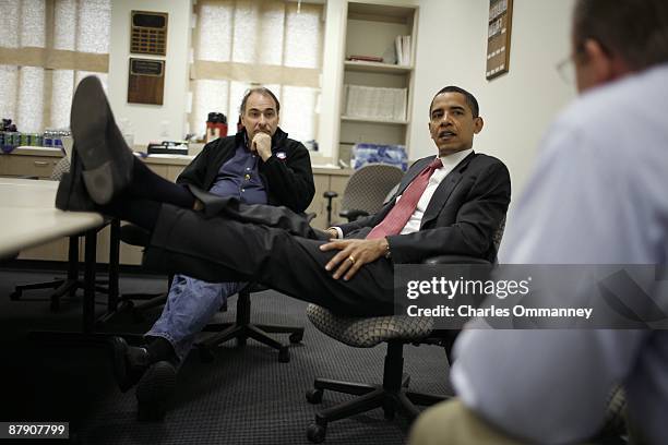 Democratic presidential candidate Illinois Senator Barack Obama huddles with his senior staff, David Axelrod and Robert Gibbs backstage before...